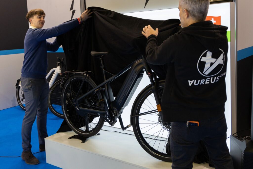 Aureus Drive unveils new speed pedelec with advanced e-bike technology at a cycling industry event.